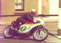 Mike Hailwood on a 6 Cyl 250cc on the Grand Prix Circuit